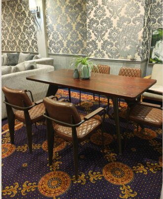 Baron 7-Piece Dining Set showcasing the mahogany-stained oak table paired with six diamond-quilted brown PU leather Bethany chairs.