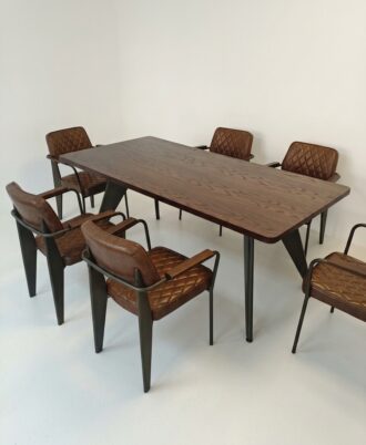 Baron 7-Piece Dining Set showcasing the mahogany-stained oak table paired with six diamond-quilted brown PU leather Bethany chairs.