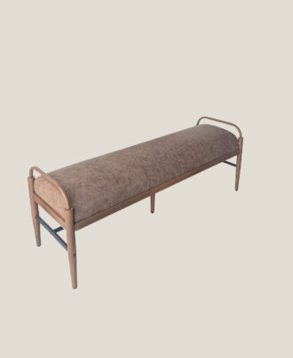 High angle view of the Fantasy upholstered bench showing the long buffalo brown cushion top and two-tone black and wood-look metal base